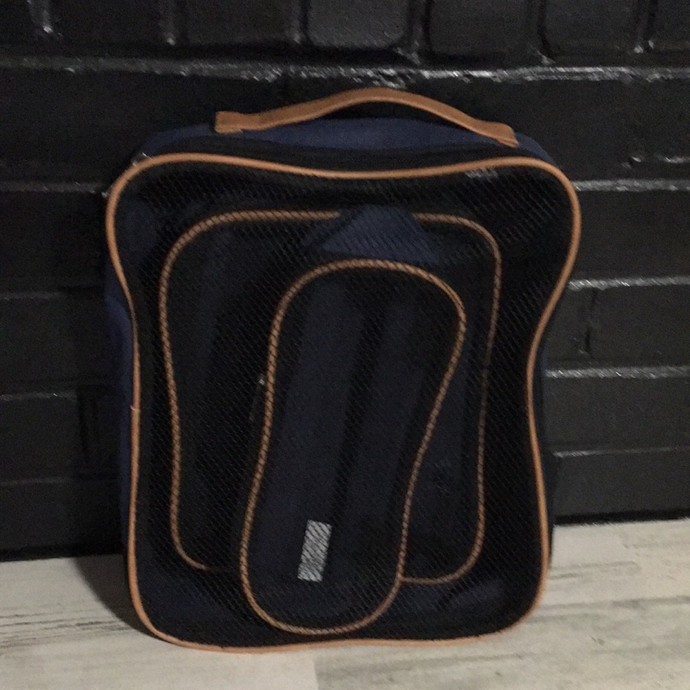 Three piece navy blue & tan cloth/mesh light zipper bags.